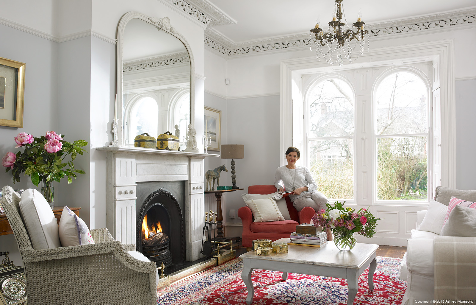Emma Cooper in the sitting room of her Victorian semi detached house in Belfast.